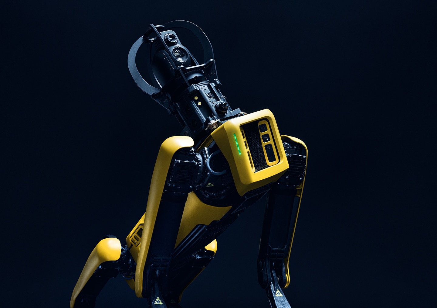 Spot, a yellow quadruped robot, equipped with an IR camera payload