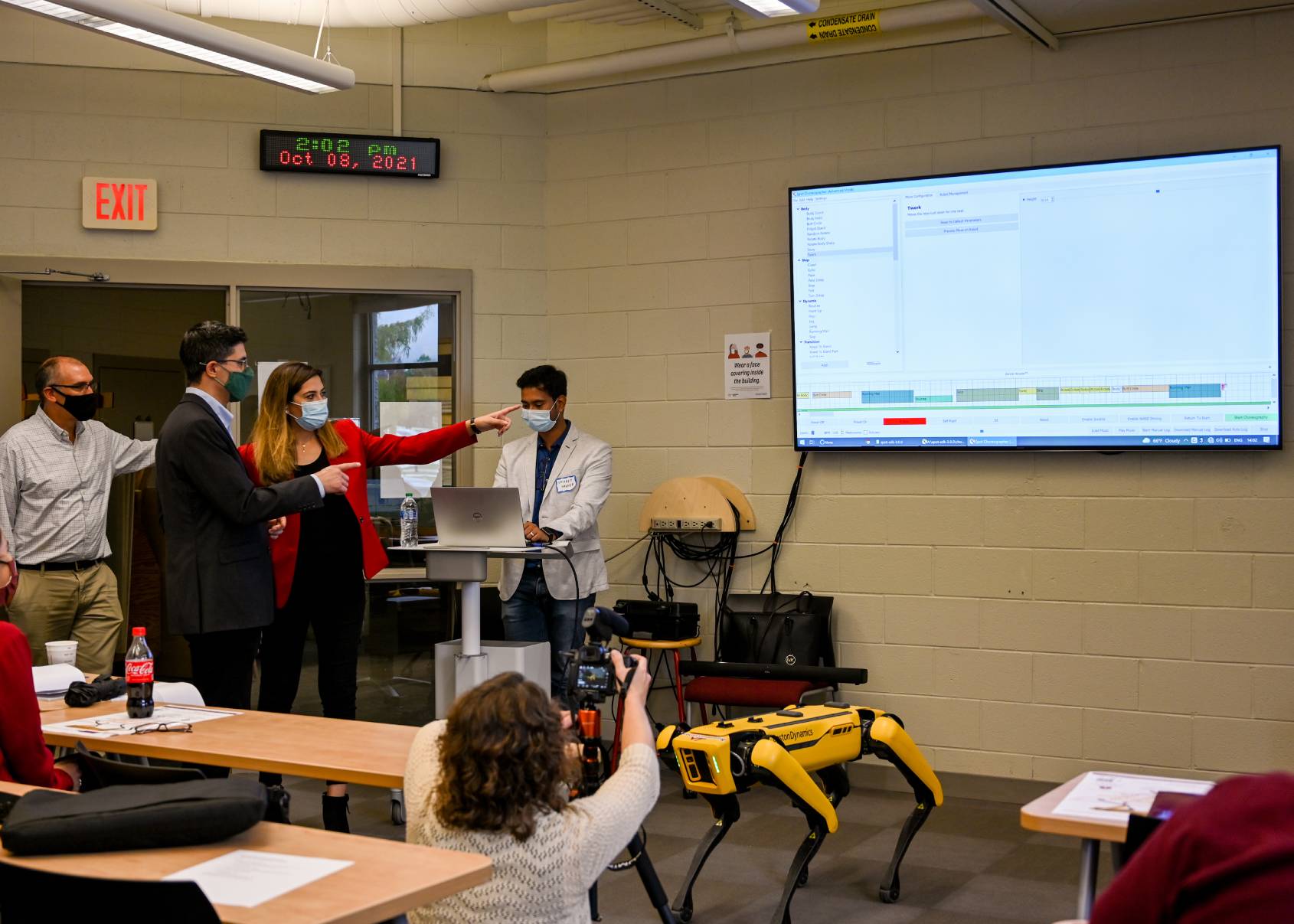 A professor demos Spot in a college classroom